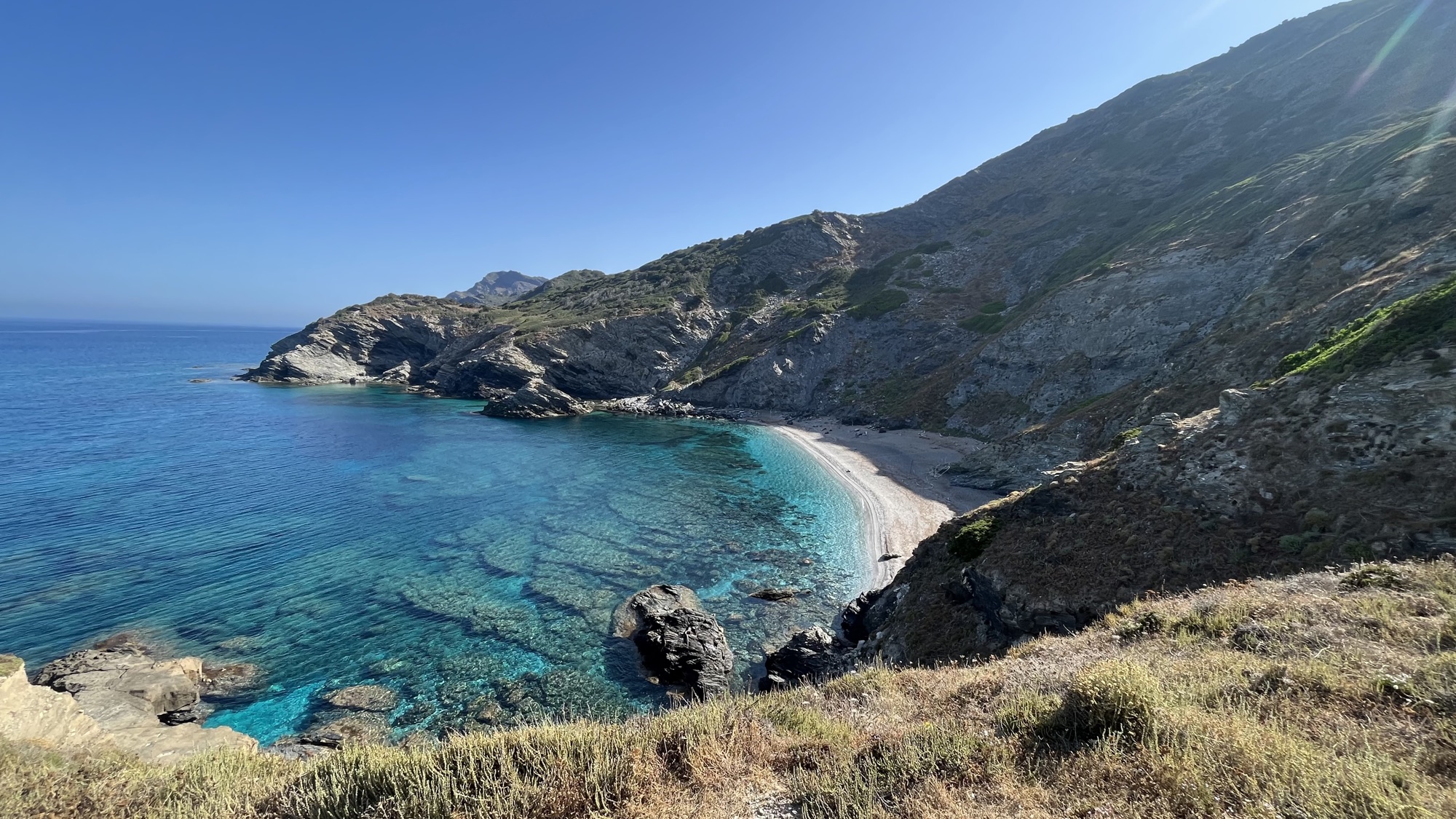 Secluded turquoise cove along the Sardinian coastline